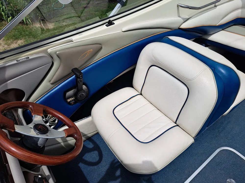 Boat interior detailed, white and blue leather seats cleaned