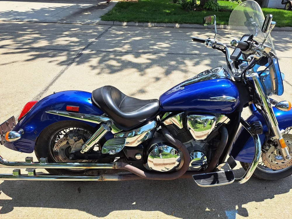 Blue cruiser motorcycle detailed with polished chrome engine