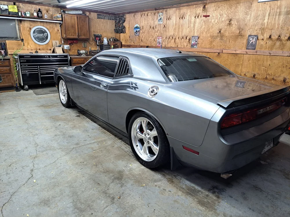 Grey Dodge Challenger detailed in the garage