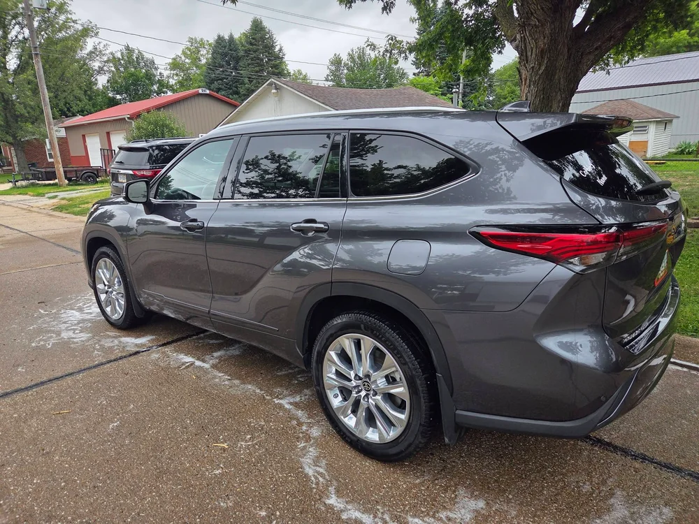 Grey Toyota Highlander detailed with a wet, glossy shine